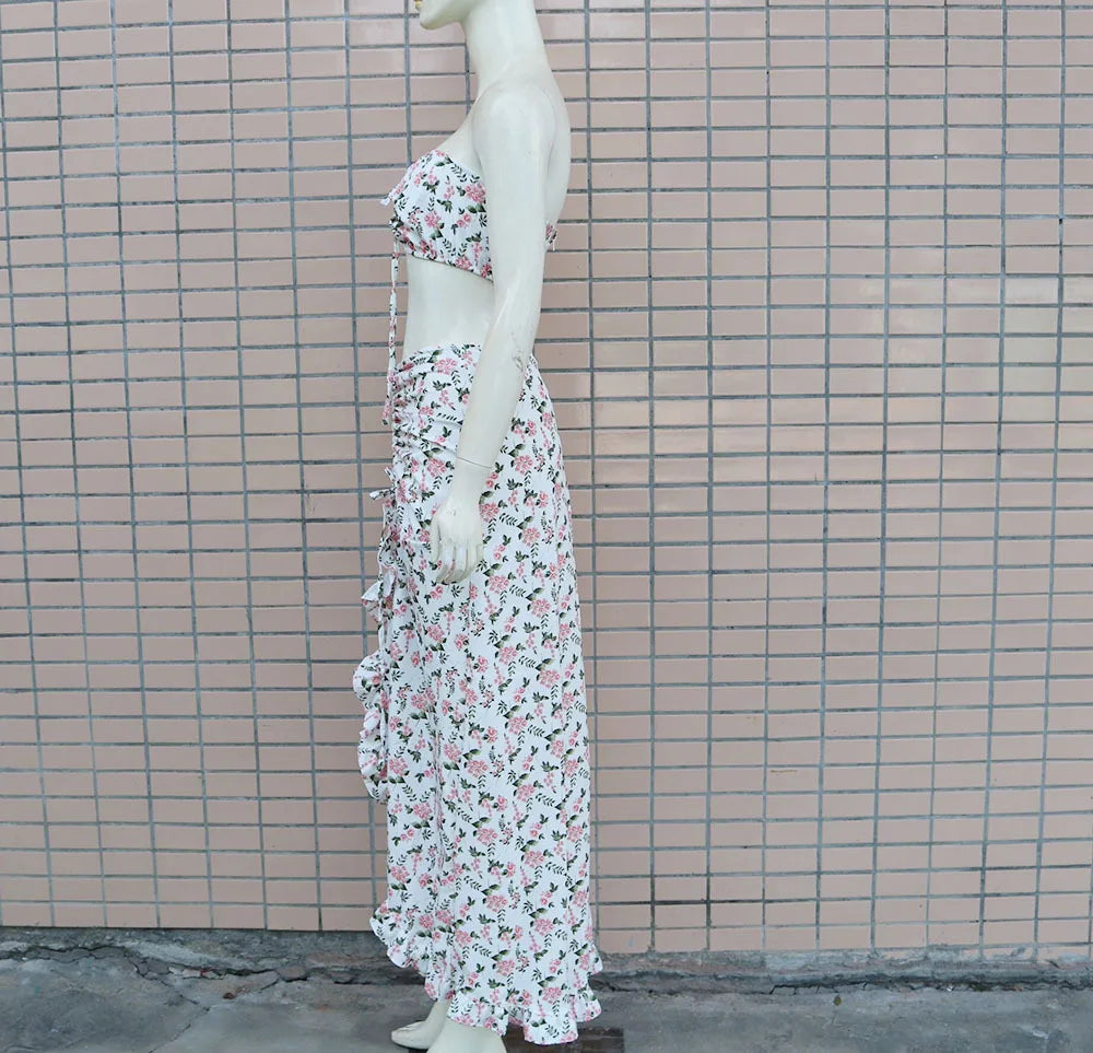 EtherealBe pleated ruffle edge dress set featuring a floral design and strapless top