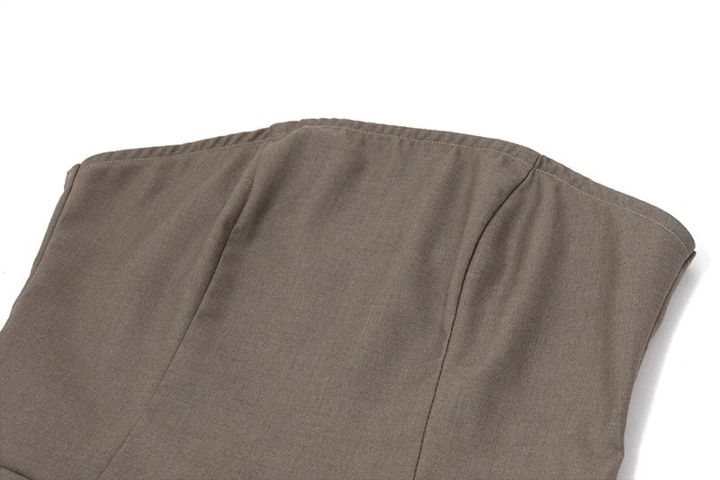 Close-up of EtherealBe pleated skirt slim fit dress in earthy brown fabric showing detailed stitching