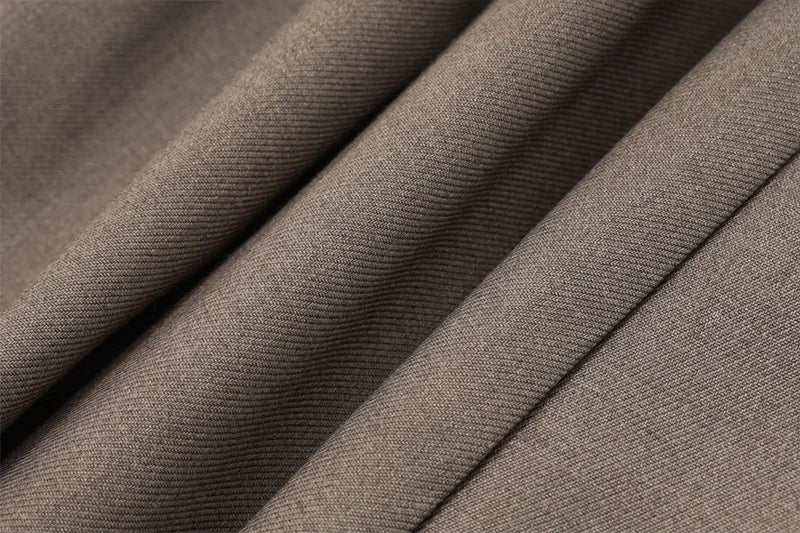 Close-up of soft brown fabric suitable for a pleated skirt slim fit dress