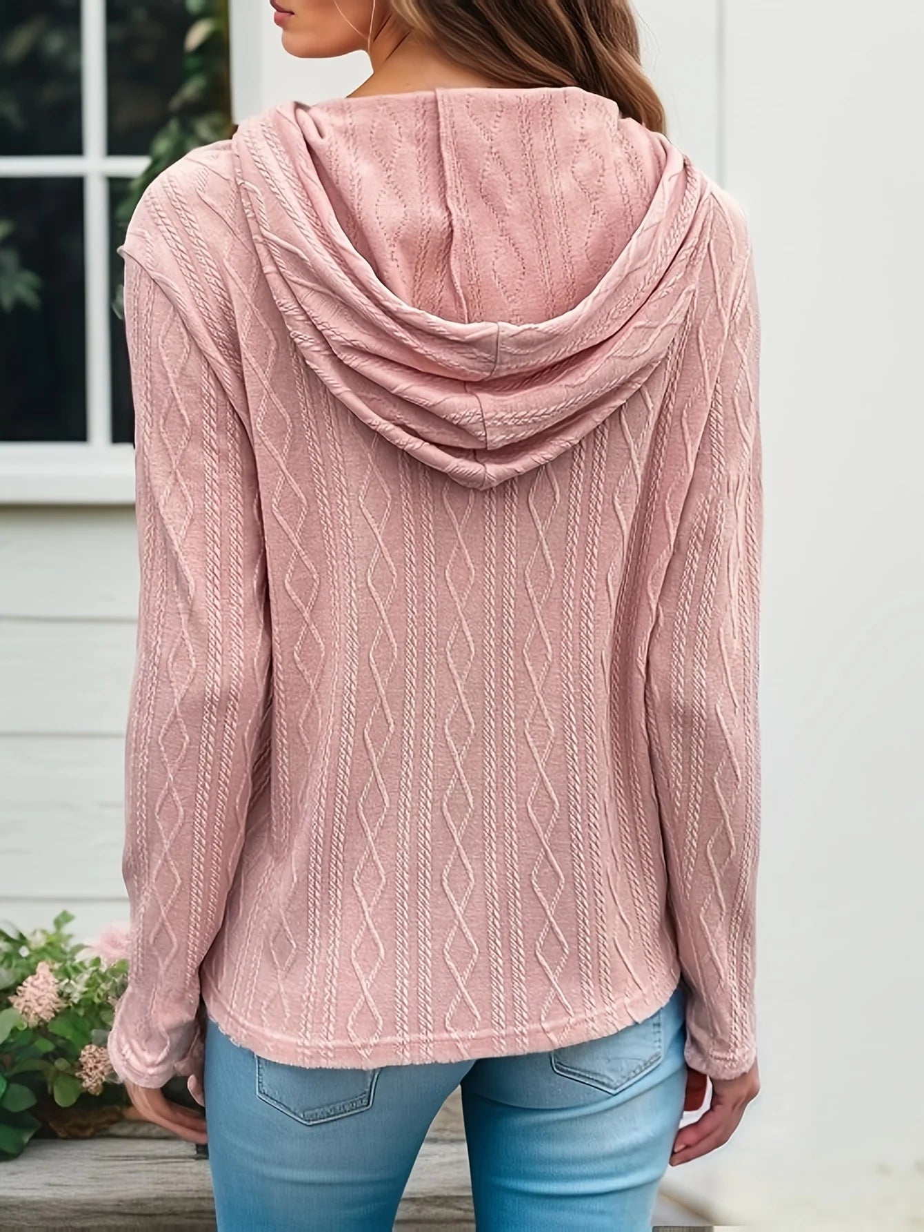 Soft pink plus size casual sweater for women with a cozy hood and cable knit design