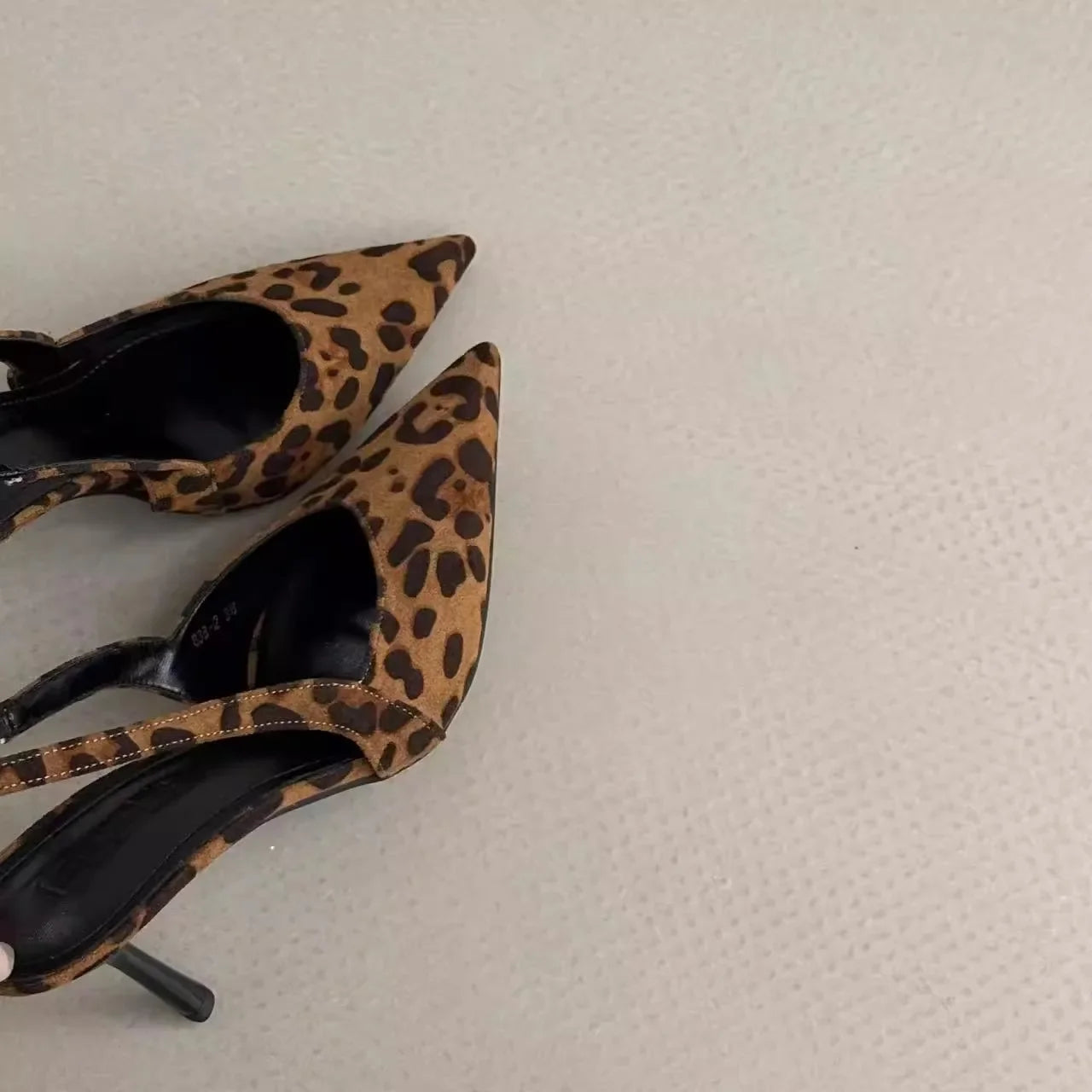 Leopard print pointed toe slingback pumps for women with a chic design and stiletto heel