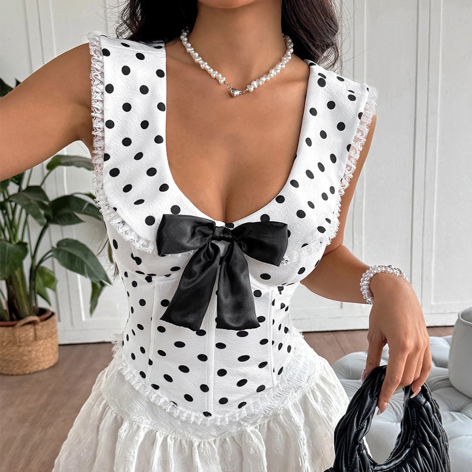 EtherealBe polka dot corset top for women with a bow detail and scalloped edges
