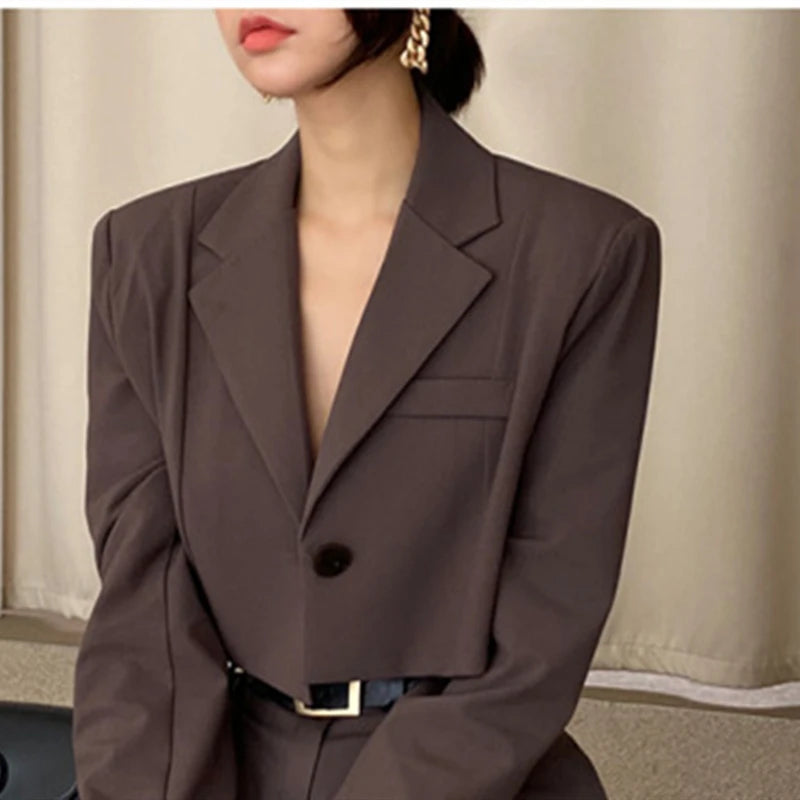 Chic brown blazer as part of professional corporate attire for women with tailored fit