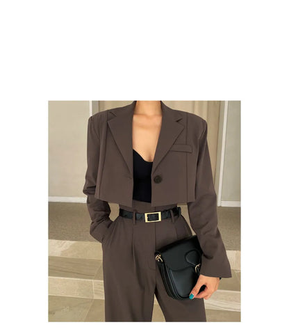 Stylish brown cropped blazer with matching high-waisted trousers, ideal for professional corporate attire for women