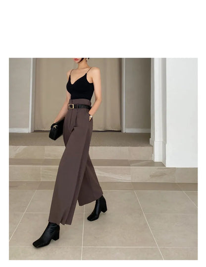 Elegant brown wide-leg trousers paired with a black top, ideal for professional corporate attire for women