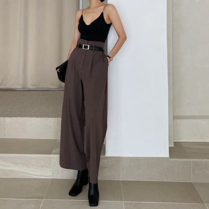 Chic brown wide-leg trousers paired with a black top, perfect for professional corporate attire for women
