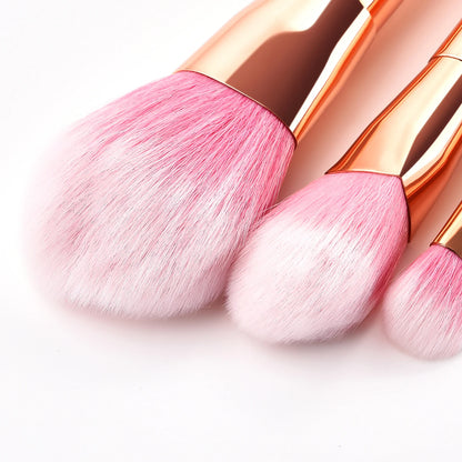 Three pink professional makeup brush tools for women with soft bristles and elegant rose gold handles