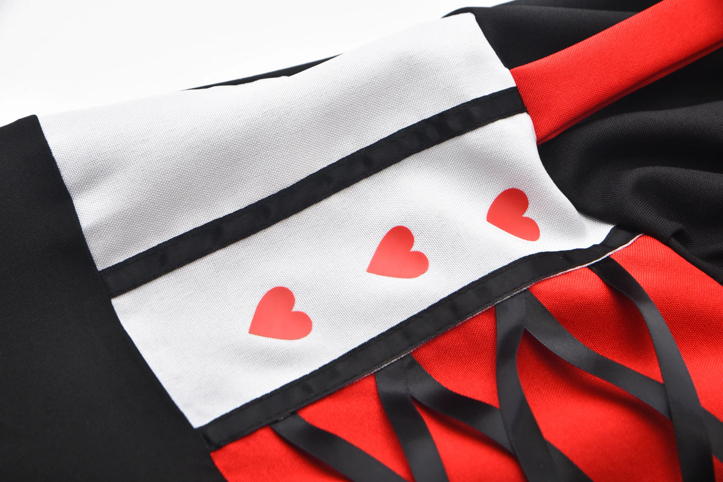 Close-up of the Queen of Hearts costume for women featuring heart details and elegant design