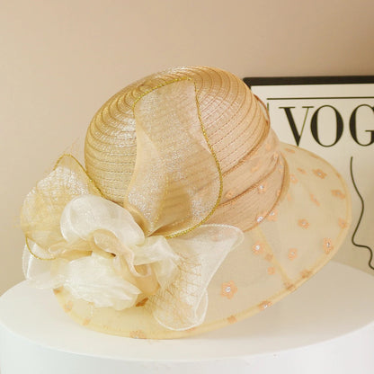 EtherealBe retro wide brim floral hat in gold with decorative bow and sheer fabric for stylish sun protection