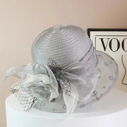 EtherealBe retro wide brim floral hat featuring a delicate flower accent and sheer ribbon detailing