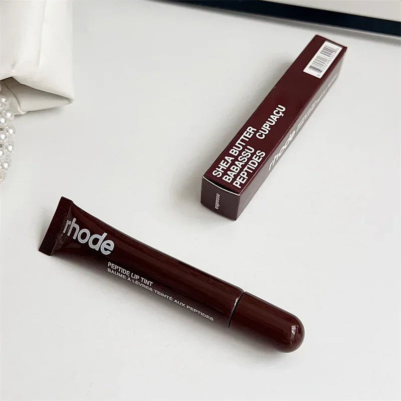 EtherealBe brown lip tint tube and box on white surface Flavored moisturizing lip balm for dry lips