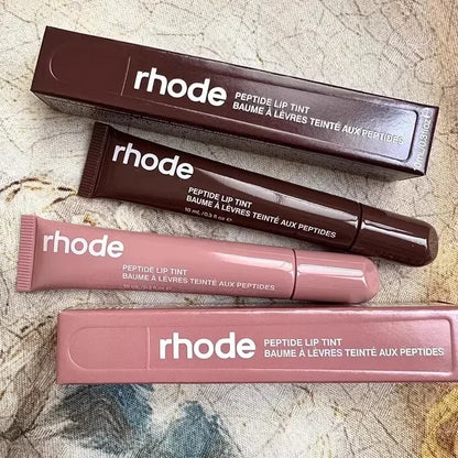 EtherealBe Rhode peptide lip tint tubes and boxes in mauve and brown Flavored moisturizing lip balm for dry lips