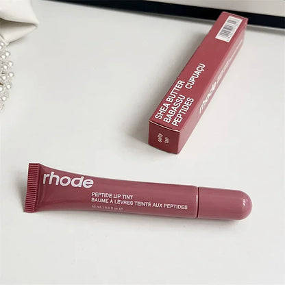 Flavored moisturizing lip balm for dry lips. Rhode peptide lip tint tube in mauve with matching box on white background