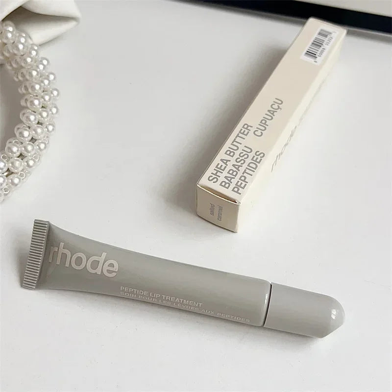Gray peptide lip treatment tube and box by EtherealBe Flavored moisturizing lip balm for dry lips.