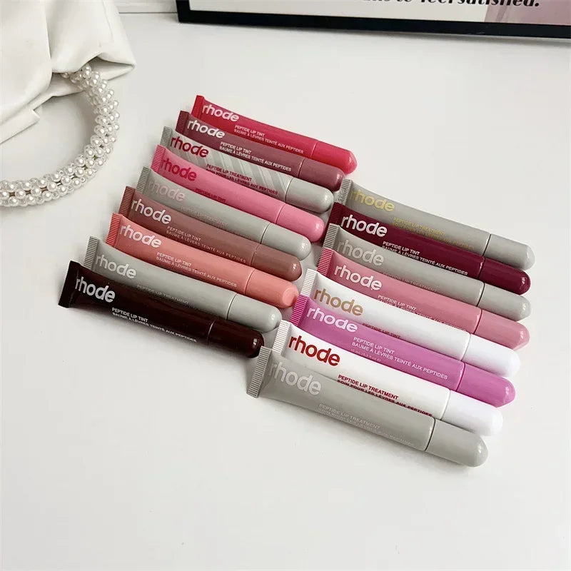 Assorted Rhode lip crayons in pink mauve and nude shades by EtherealBe Flavored moisturizing lip balm for dry lips.