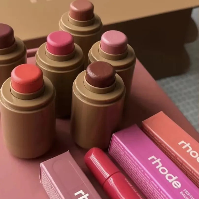 EtherealBe assortment of tinted balm sticks and boxes displayed Flavored moisturizing lip balm for dry lips.