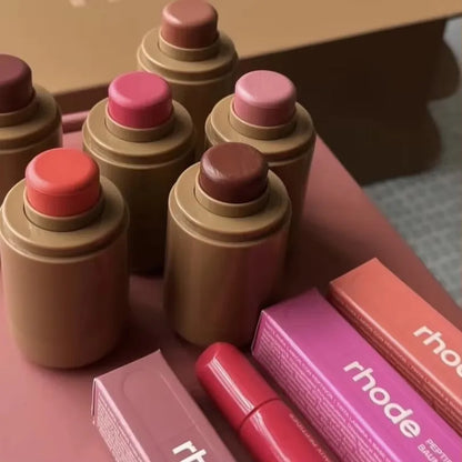 EtherealBe assortment of tinted balm sticks and boxes displayed Flavored moisturizing lip balm for dry lips.