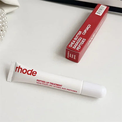 White Rhode peptide lip treatment tube with red box branding, Flavored moisturizing lip balm for dry lips.