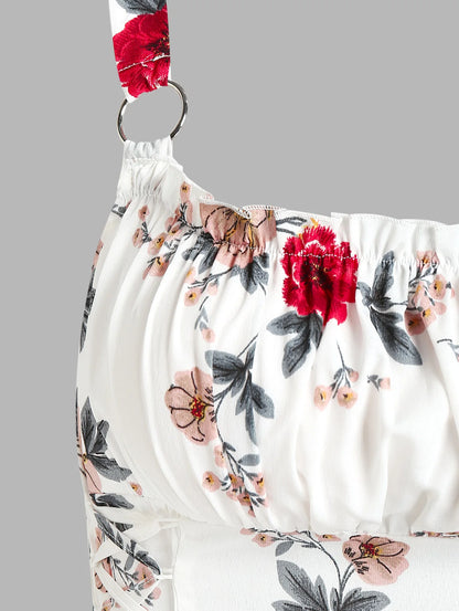 Close-up of ruffled bowknot mini summer dress by EtherealBe featuring floral print and detailed ruching