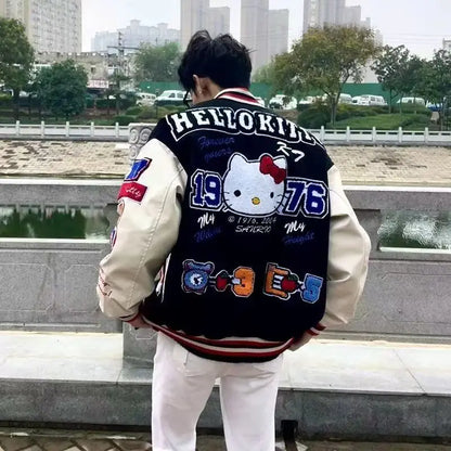 Man wearing black and cream varsity style Hello Kitty baseball jacket with large embroidered back patch