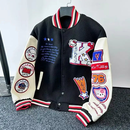 Black and cream varsity style Hello Kitty baseball jacket with embroidered patches and red striped trim