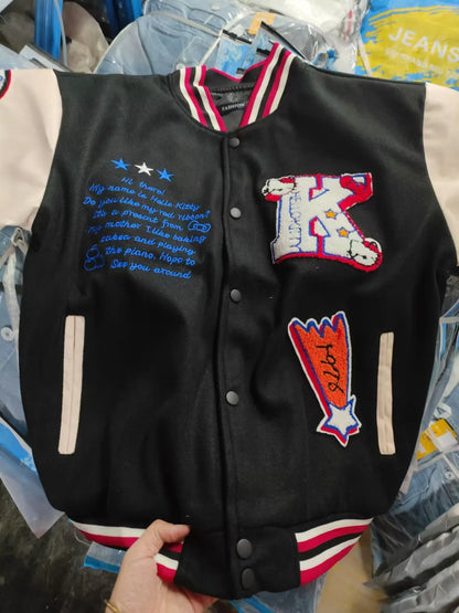 Hello Kitty baseball jacket black varsity with cream sleeves embroidered K patch blue script and striped collar