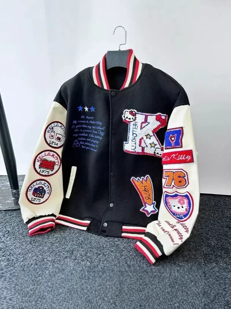Hello Kitty baseball jacket black varsity style with cream sleeves embroidered Kitty patches red white striped collar and cuffs