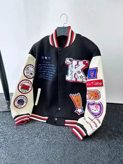 Hello Kitty baseball jacket black varsity style with cream sleeves embroidered Kitty patches red white striped collar and cuffs