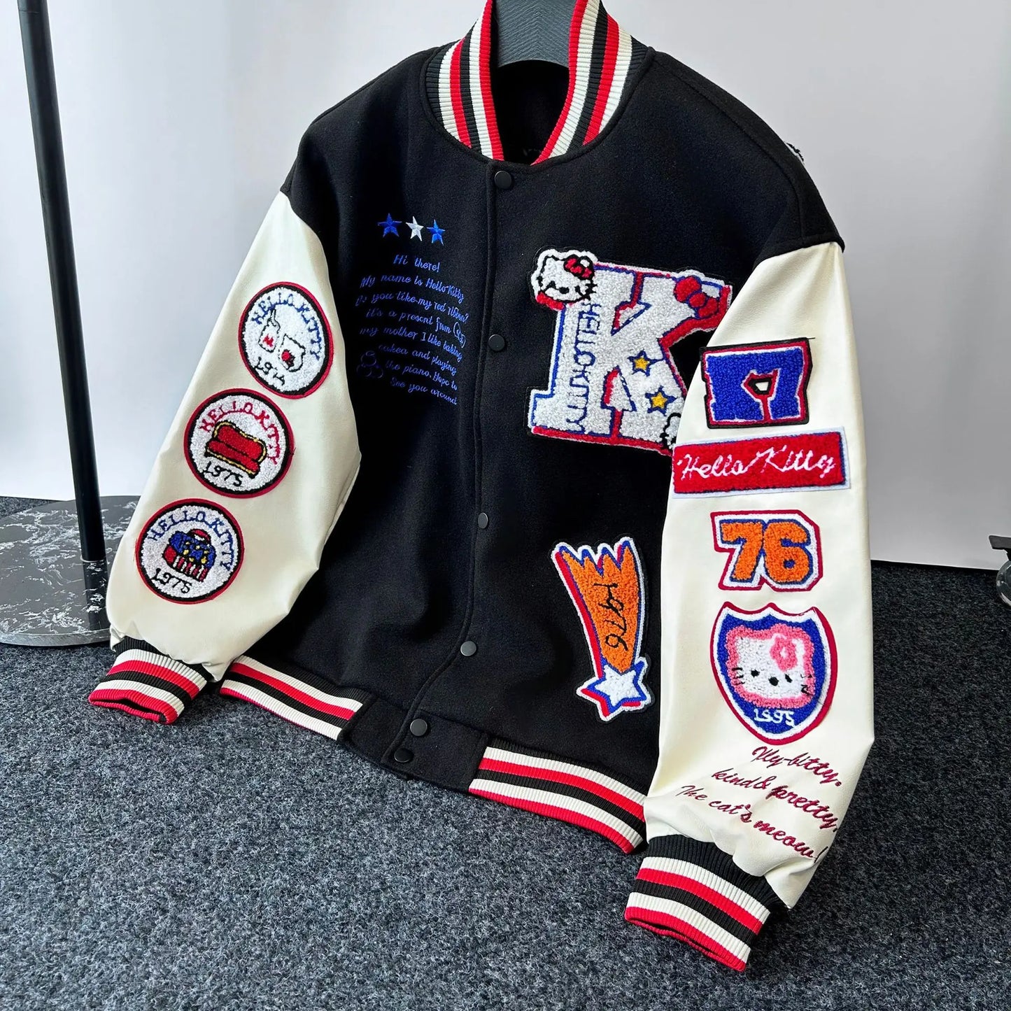 EtherealBe Hello Kitty baseball jacket black varsity style with cream sleeves embroidered patches