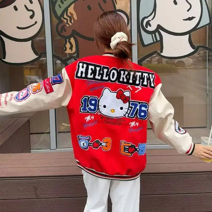 Back view of person wearing red and cream Hello Kitty baseball jacket with 1976 patch and colorful patches