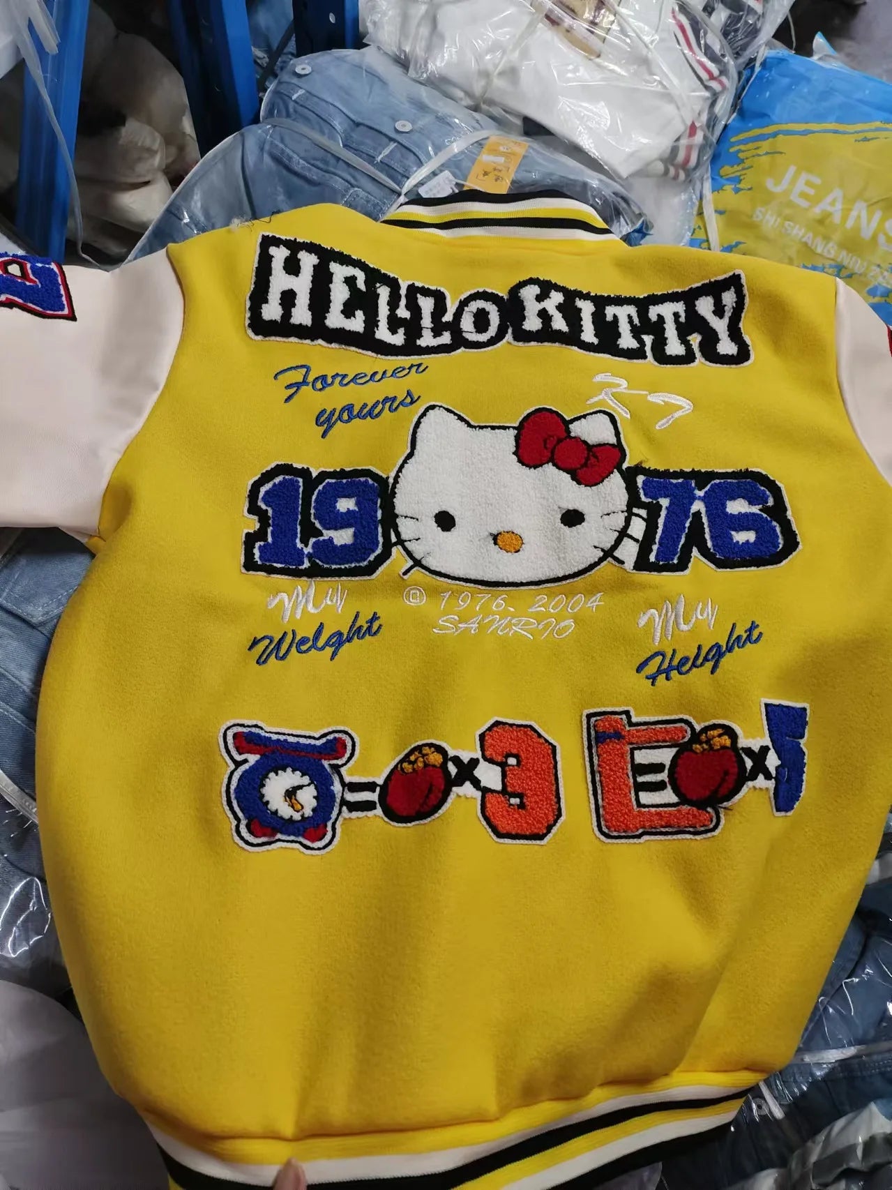 Hello Kitty baseball jacket yellow varsity style back view with embroidered Hello Kitty 1976 patch