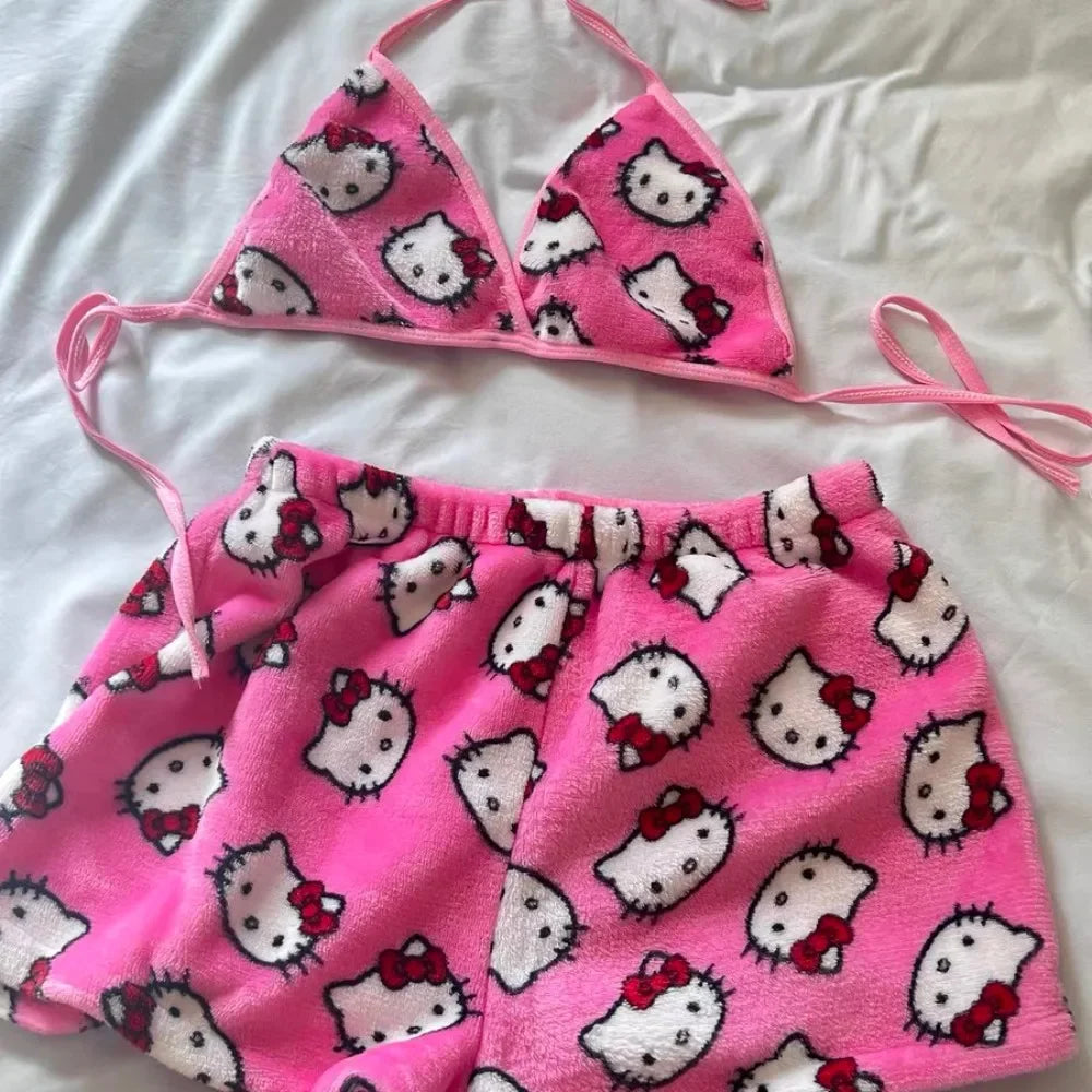 Ladies Hello Kitty bra and shorts sleepwear. Pink fleece triangle bra with tie straps and elastic waist shorts on white background