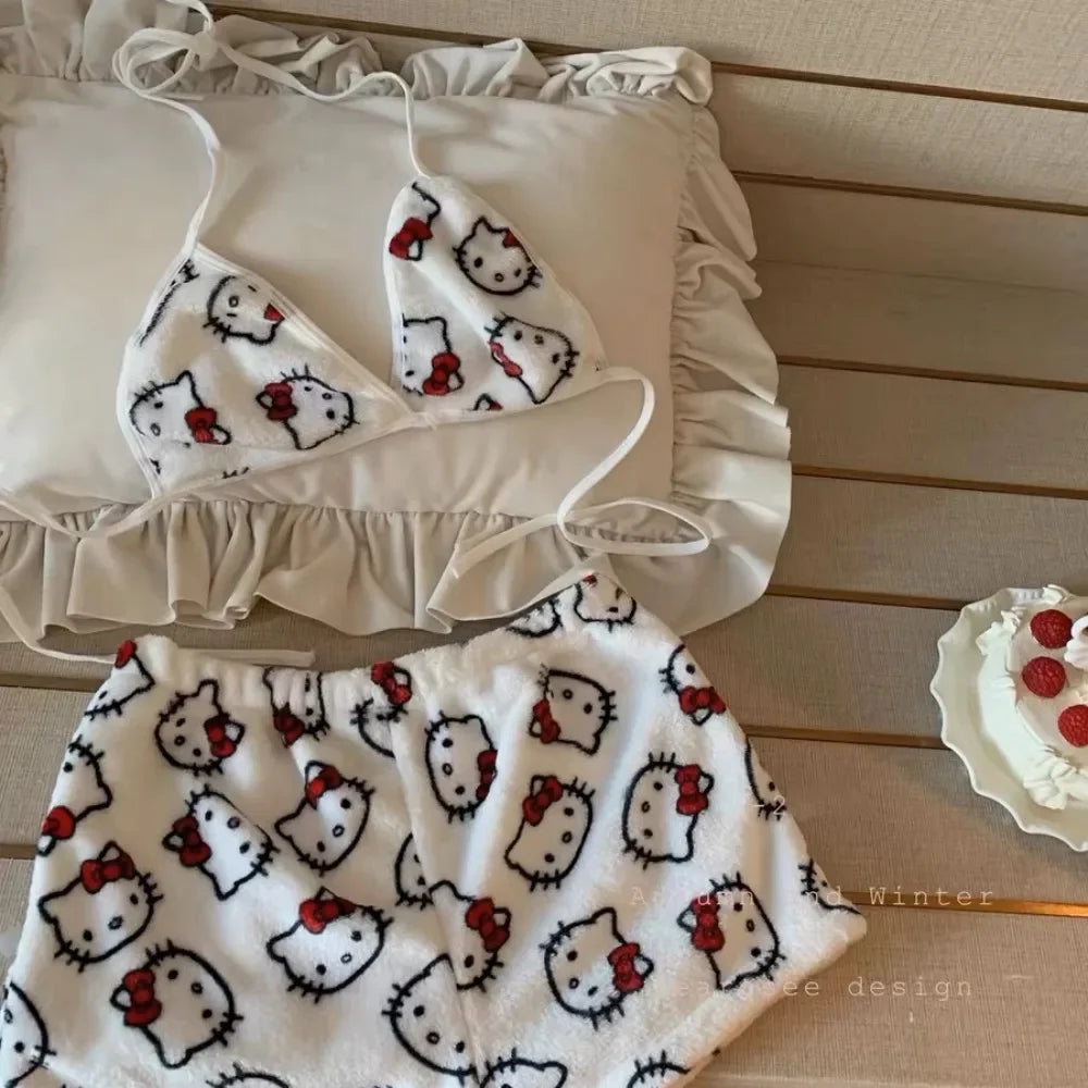Ladies Hello Kitty bra and shorts sleepwear. Soft white fleece set with red bow print on cozy bed