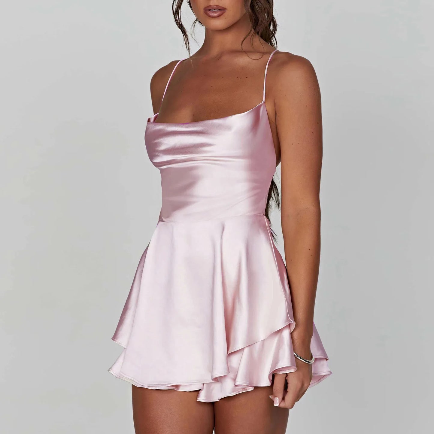 EtherealBe satin silk backless cami romper in light pink with a flared skirt design