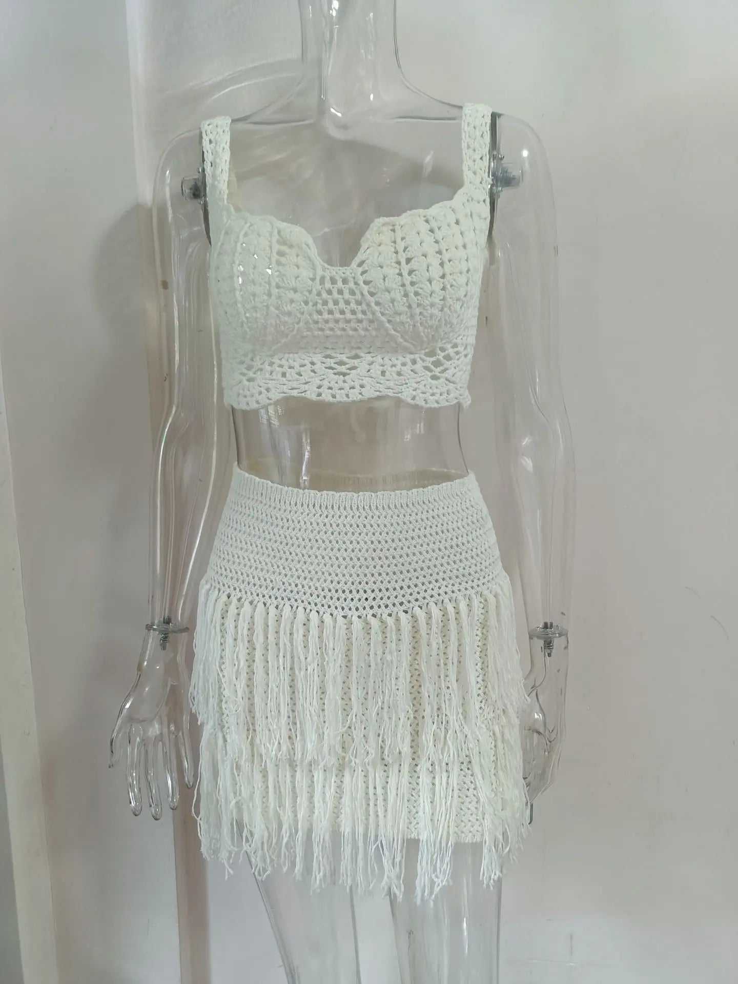 EtherealBe see through tassel skirt set featuring a crocheted crop top and fringed mini skirt