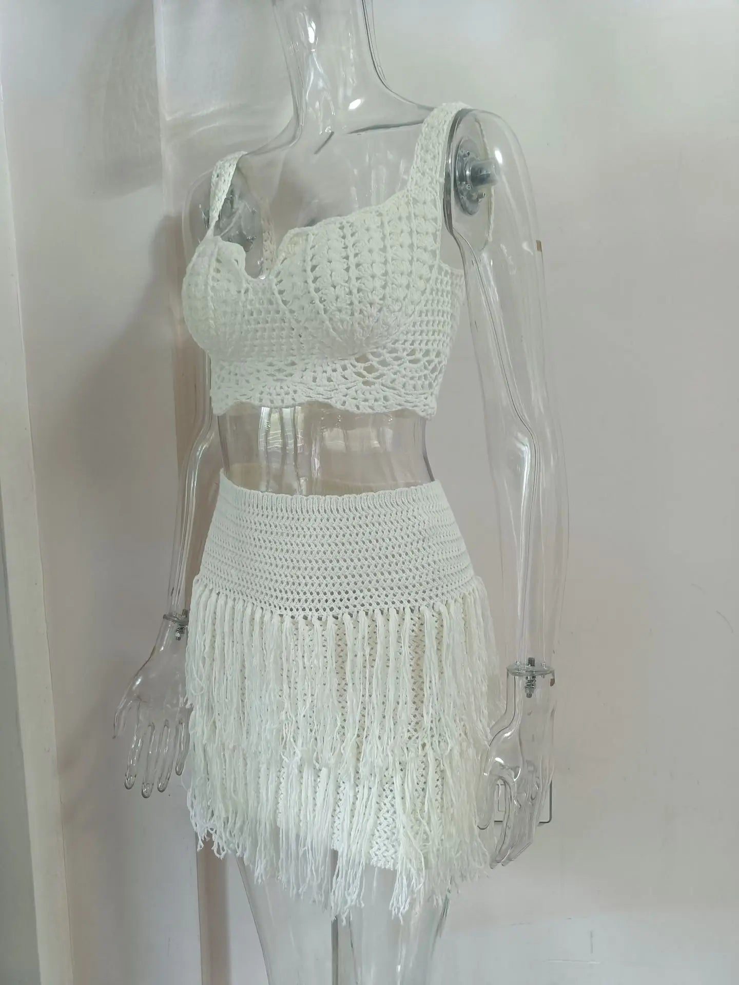 EtherealBe see through tassel skirt set featuring a stylish crop top and fringed mini skirt