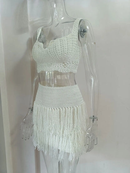 EtherealBe see through tassel skirt set featuring a stylish crop top and fringed mini skirt