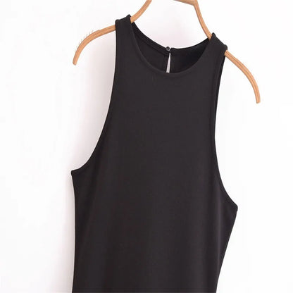 EtherealBe sleeveless chic cocktail dress in black hanging on a wooden hanger