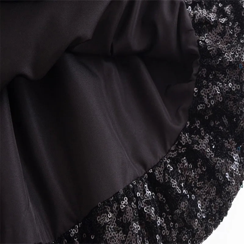 Elegant sleeveless chic cocktail dress in black with shiny sequin detailing for a stunning look