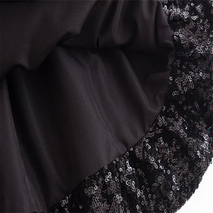 Elegant sleeveless chic cocktail dress in black with shiny sequin detailing for a stunning look