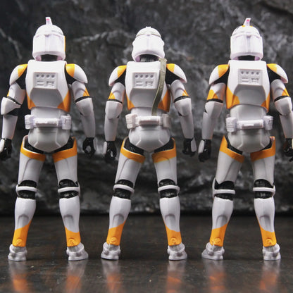 Three EtherealBe Star Wars 212th Clone Trooper action figures in white and orange armor from the back