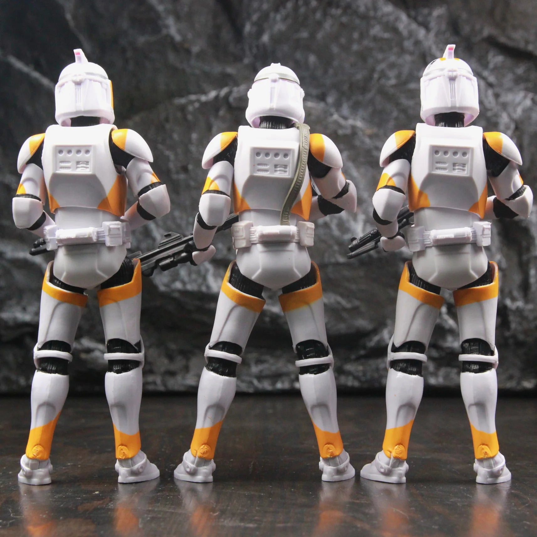 Star Wars 212th Clone Trooper action figure in detailed armor, showcasing back view and weapon accessories