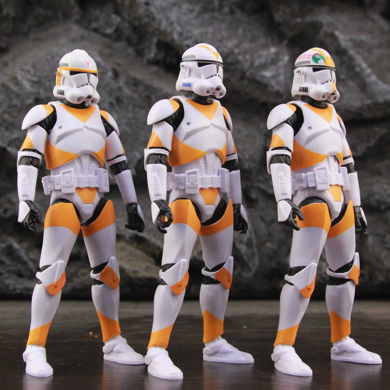 Star Wars 212th Clone Trooper action figure set featuring three detailed troopers in orange and white armor