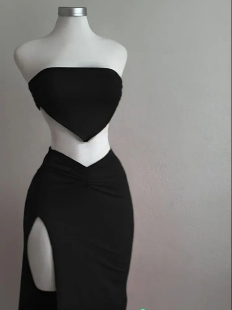 EtherealBe strapless backless two piece set in black featuring a stylish top and a chic skirt