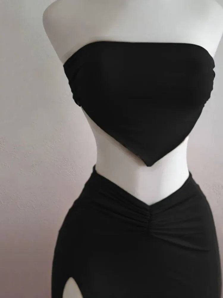EtherealBe strapless backless two piece set in black featuring a sleek crop top and high-waisted skirt