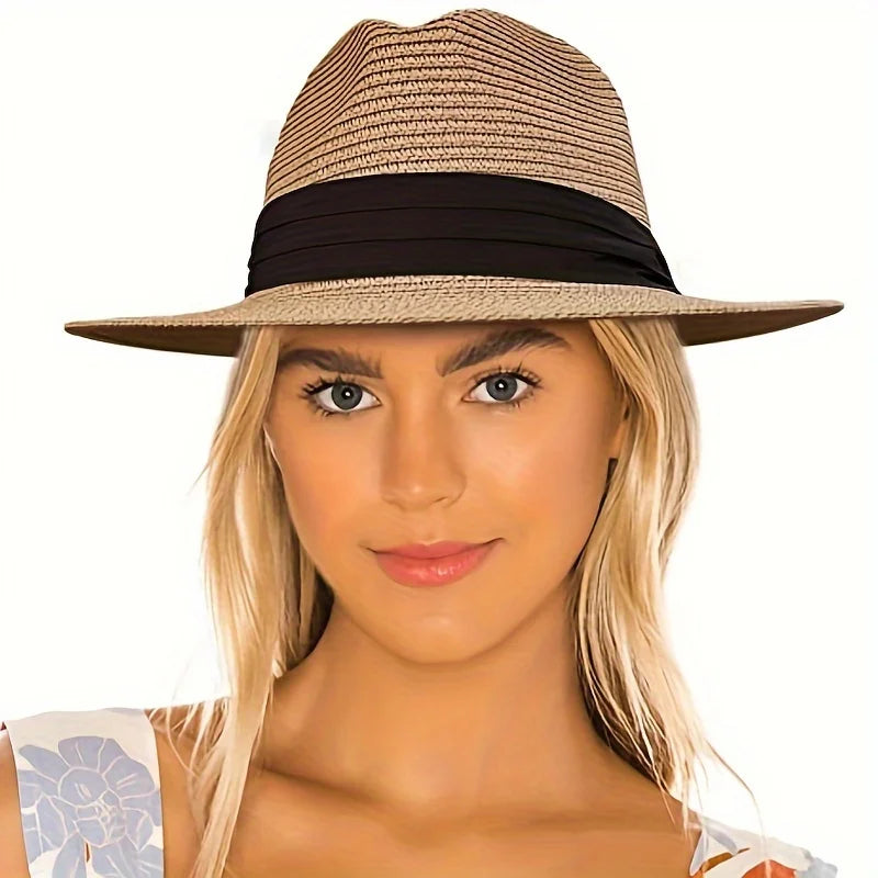 Trendy straw fedora hat with a stylish black band, perfect for summer outings and beach days
