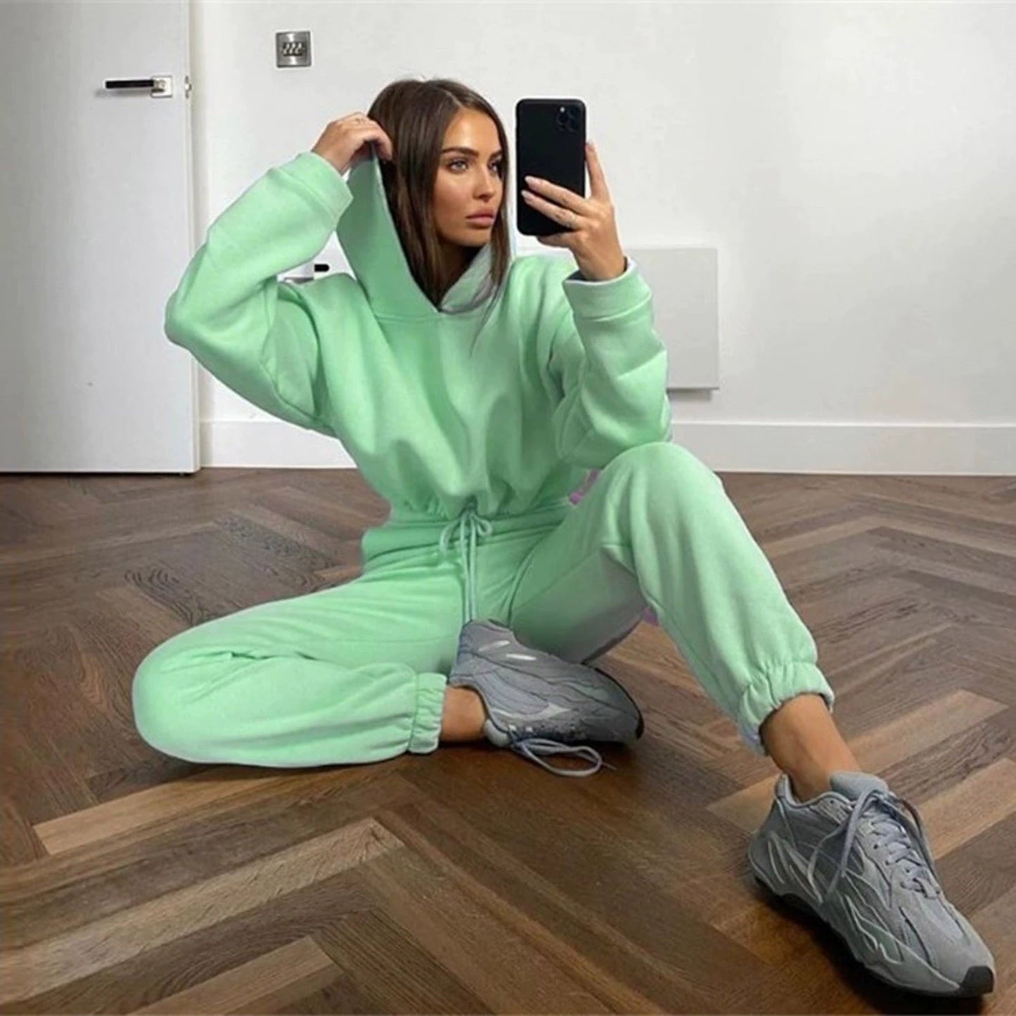Trendy women's hoodie and joggers set in mint green for stylish comfort