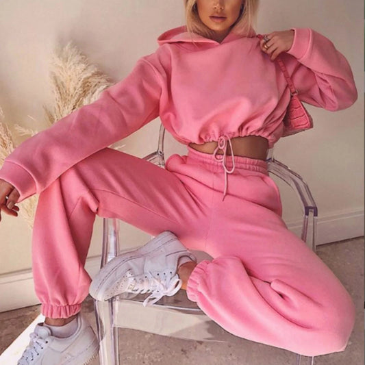 Trendy women's hoodie and joggers set in pink with an oversized fit and elastic cuffs