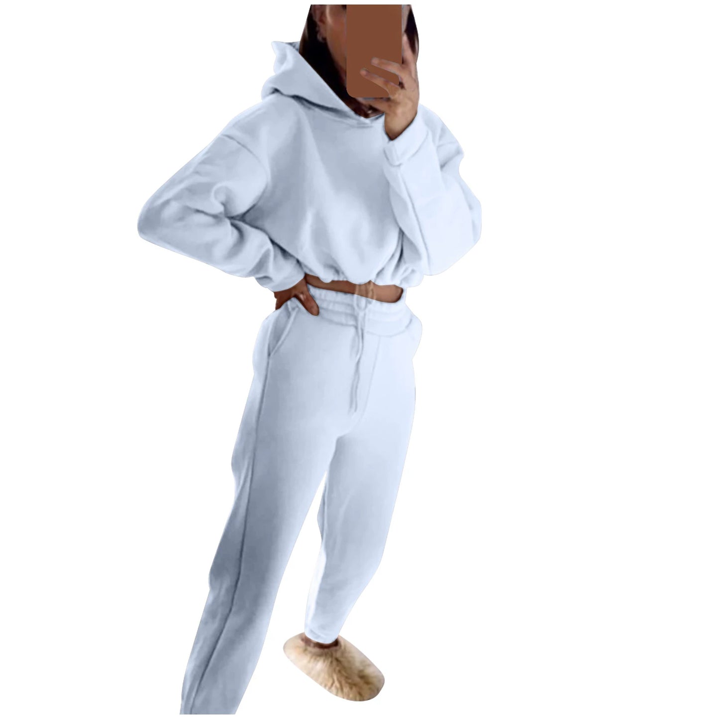 Stylish model wearing a trendy women's hoodie and joggers set in soft white fabric