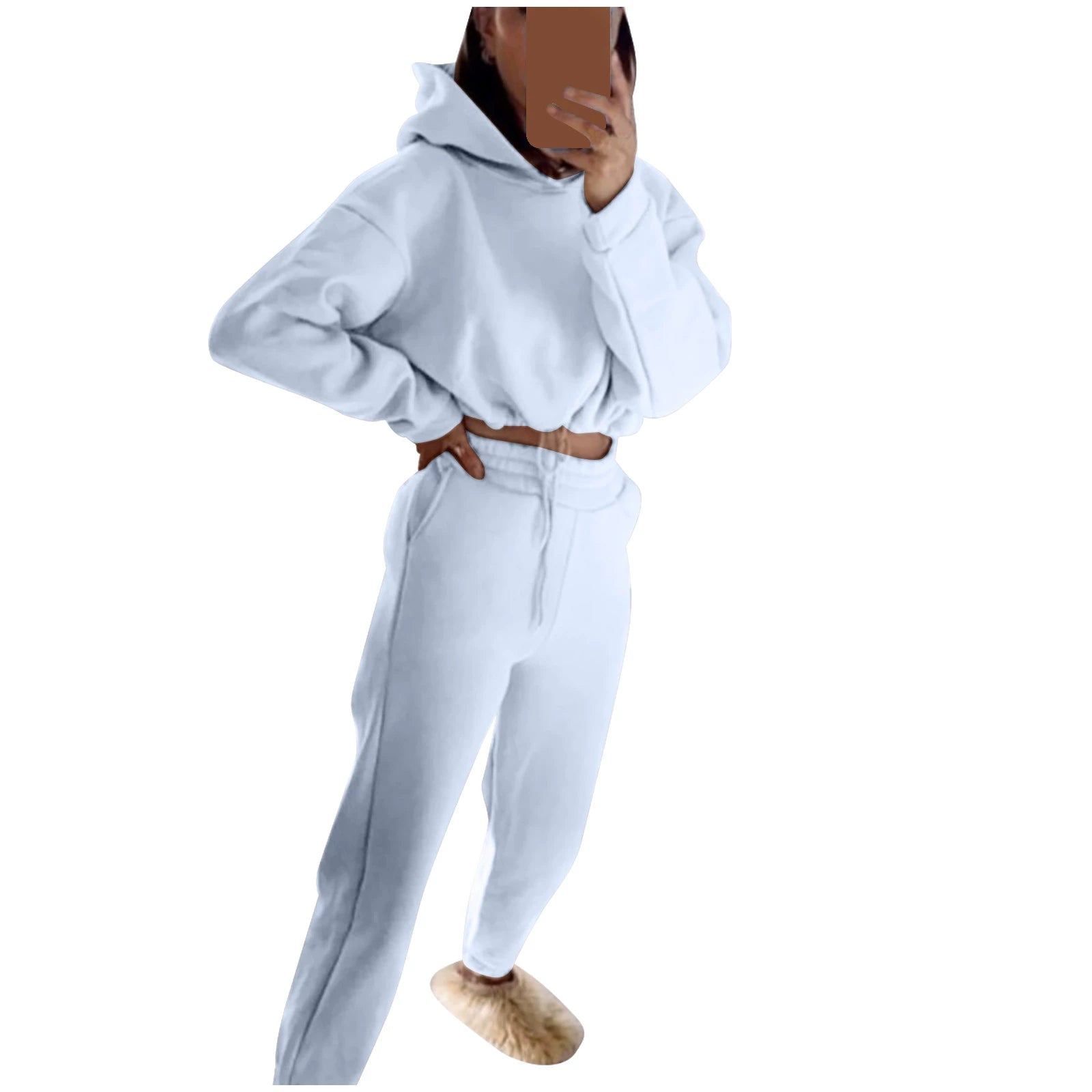 Stylish model wearing a trendy women's hoodie and joggers set in soft white fabric